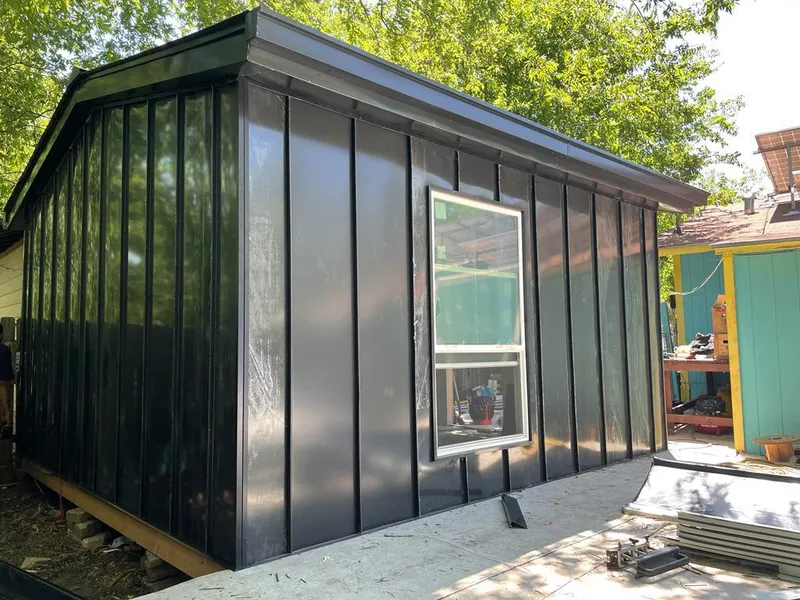 Black standing seam metal wall panels for Roof Inspection in Seagoville